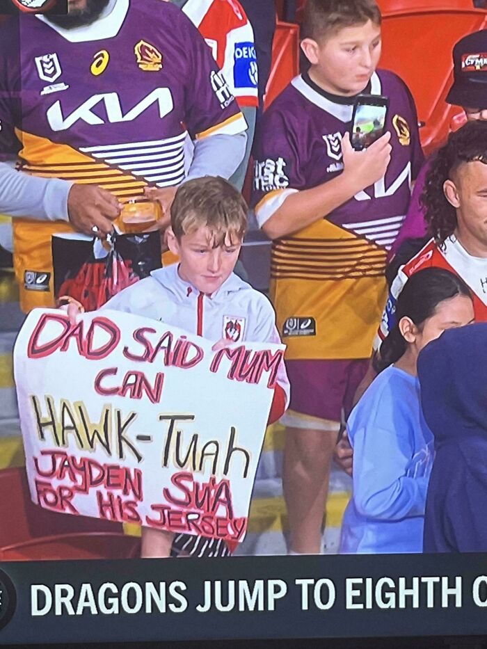 This Sign A Kid Is Holding Up At A Football Game