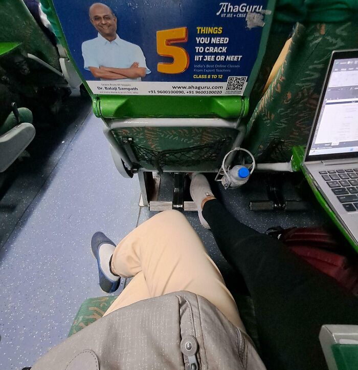 Crowded bus with people's feet on seats, displaying habits of infuriating public transport passengers.