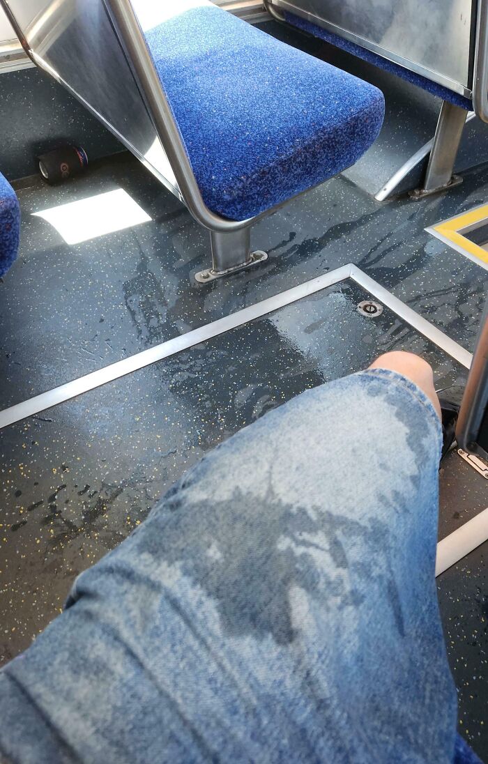Wet floor on public transport causes inconvenience to passengers.