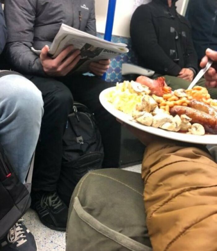A Bloke Tucking Into Full English Breakfast On The Tube