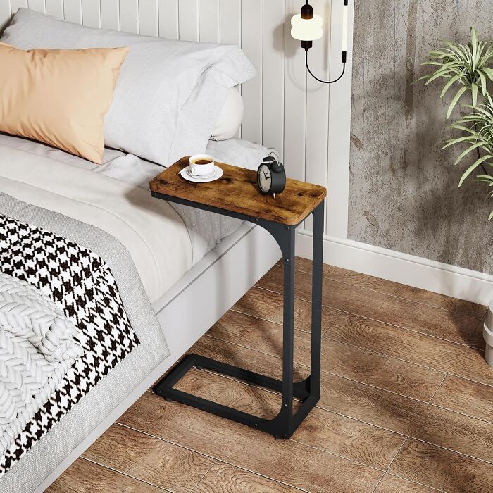 This C-Shaped Table Is The Perfect Way To Maximize Your Space (And Your Laziness)! It Slides Right Under Your Couch Or Bed, Giving You A Convenient Surface For Snacks, Drinks, Or Even Your Laptop