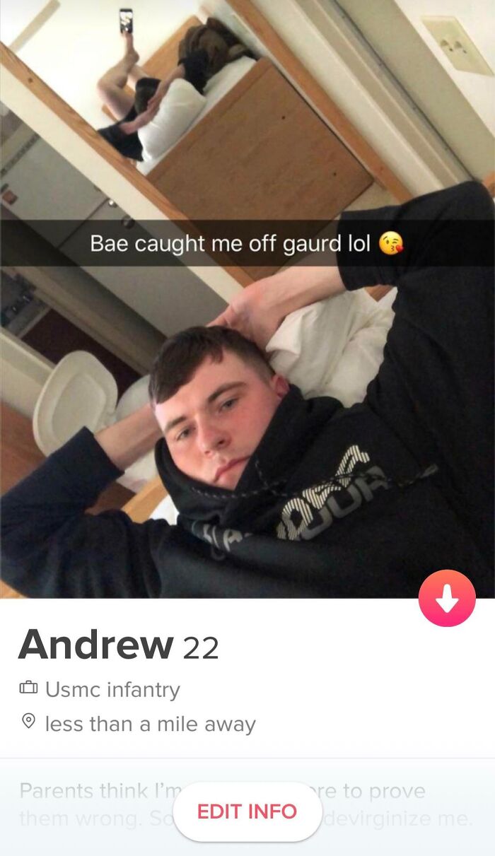 Tinder profile image with a young man posing on a bed, humorous caption overlayed.