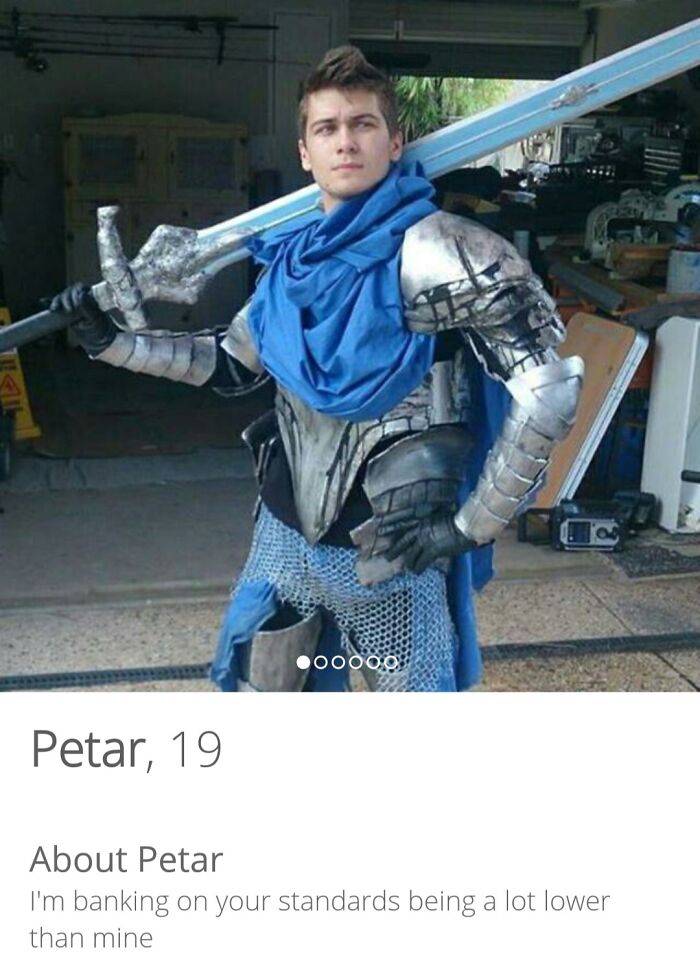 Man in medieval armor holding a large sword, posing for a Tinder profile that went off the rails.