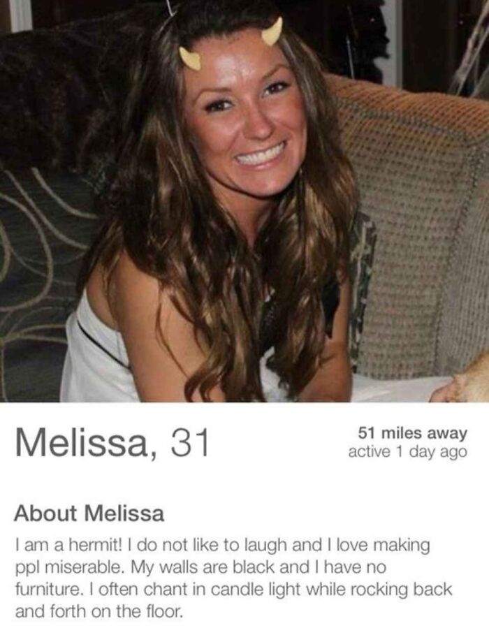 Woman with devil horns smiling in a humorous Tinder profile; offbeat bio describes her as a hermit with quirky habits.