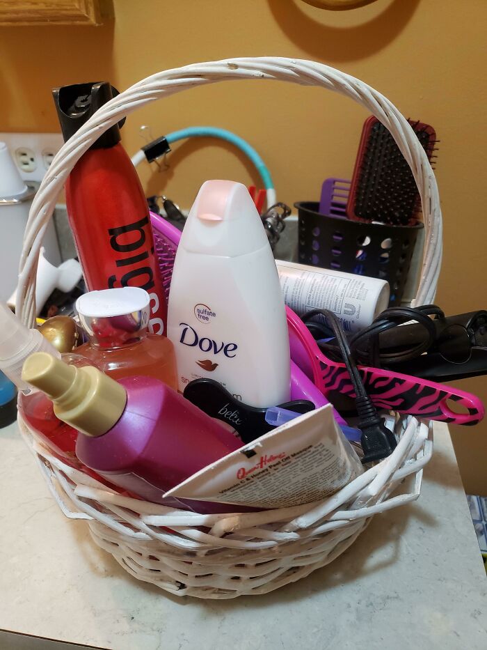Basket filled with beauty products and hair tools, a gift idea for amazing mothers-in-law.