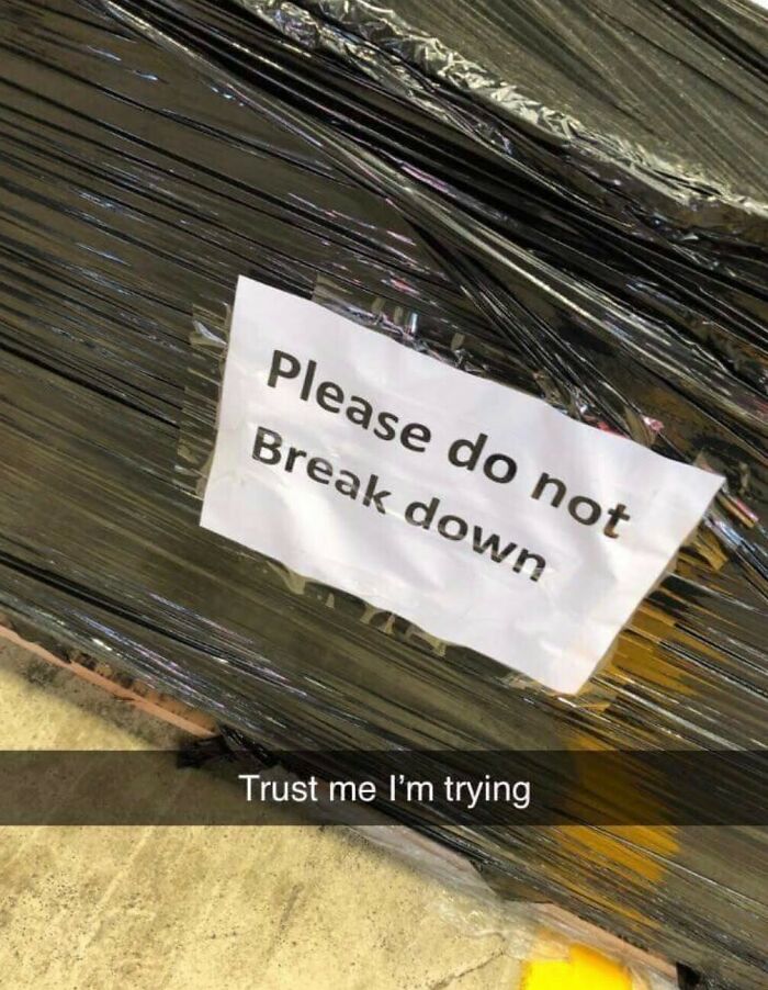 Sign on a wrapped pallet saying "Please do not break down" with the text "Trust me I'm trying" below, illustrating a mental health meme.