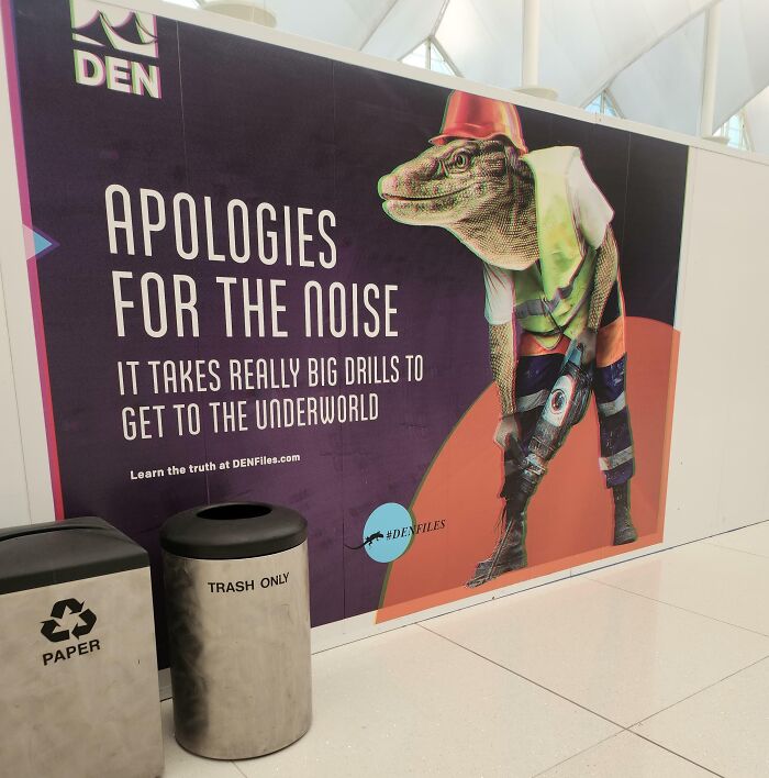 Lizard in construction gear on an ad with text apologizing for noise, part of a funny ad fail in an airport setting.
