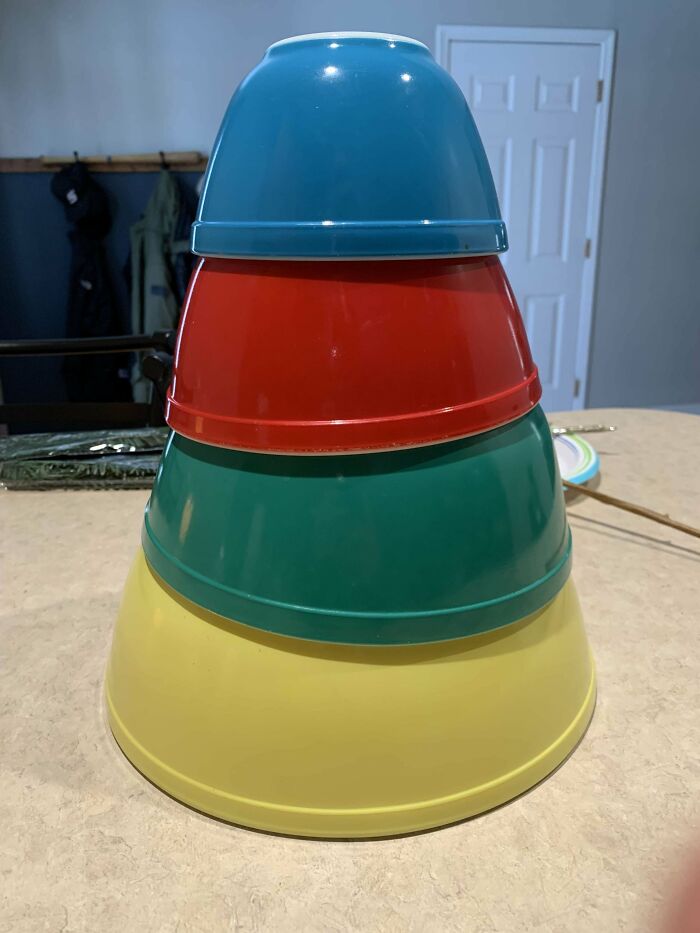 Colorful stacked bowls on a kitchen counter, symbolizing amazing mothers-in-law's creativity in organizing spaces.