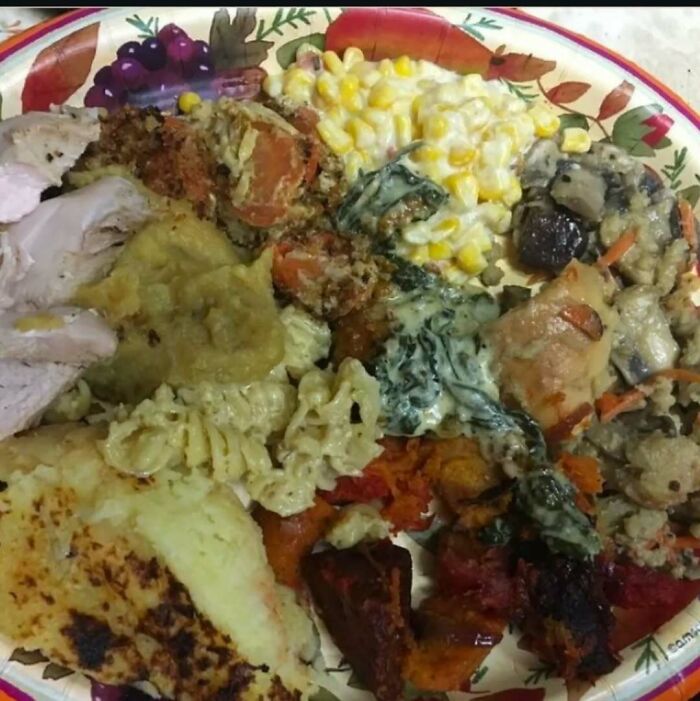 Unappetizing food assortment on a decorative plate, featuring mixed vegetables and meats.