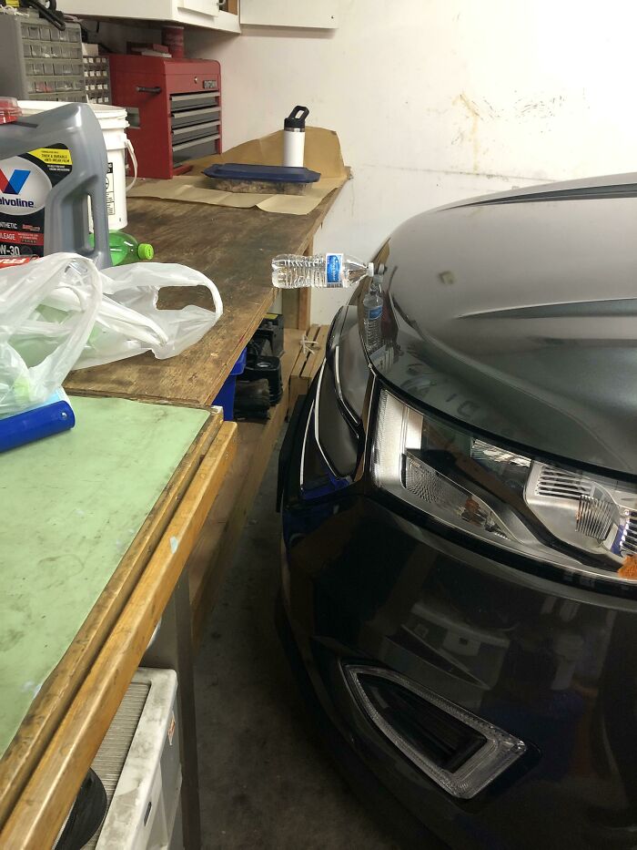 Car parked too close to workspace, infuriating family members with limited garage space.