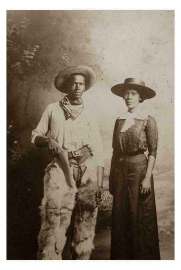 Historical photo of a man and woman in vintage attire, likely not seen in textbooks, showcasing unique period clothing.
