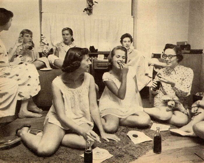 Vintage photo of a group enjoying snacks and drinks, featuring aspects you haven't seen in history textbooks.