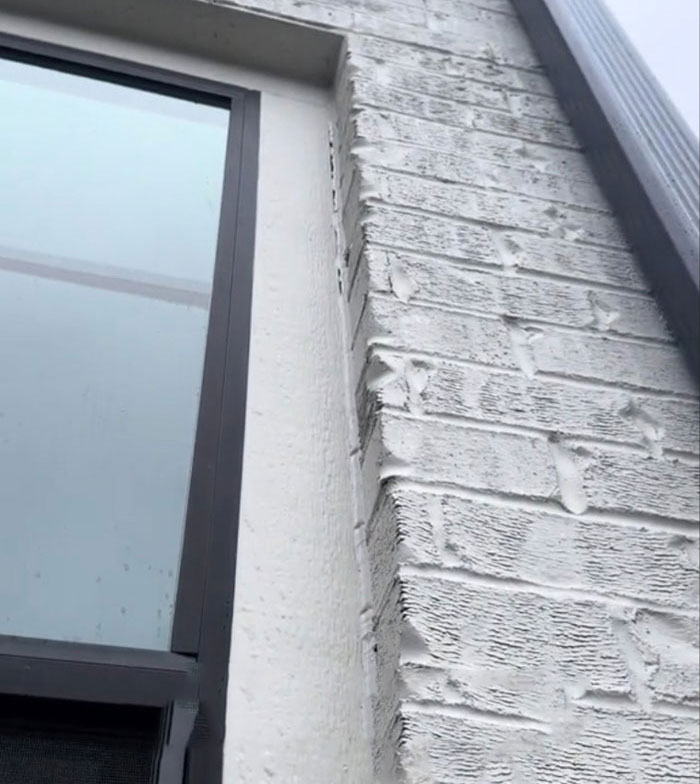 Exterior corner of a two-year-old $1,600,000 home showing poor construction condition.