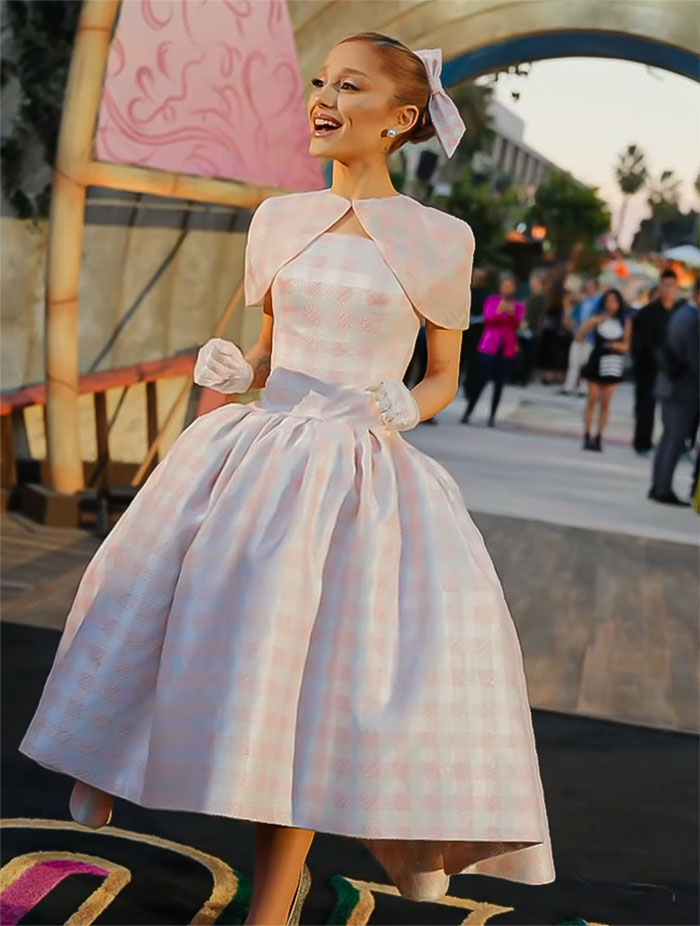 Ariana Grande at movie premiere in vintage dress, highlighting her "robotic" look, sparking concern among fans.