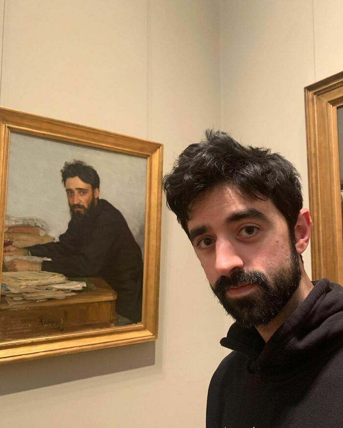 Man resembling painting in gallery, uncanny doppelgangers side by side.