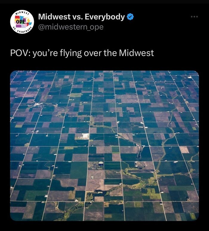 Aerial view of Midwest's patchwork farmland, showcasing vast, grid-like agricultural landscape.