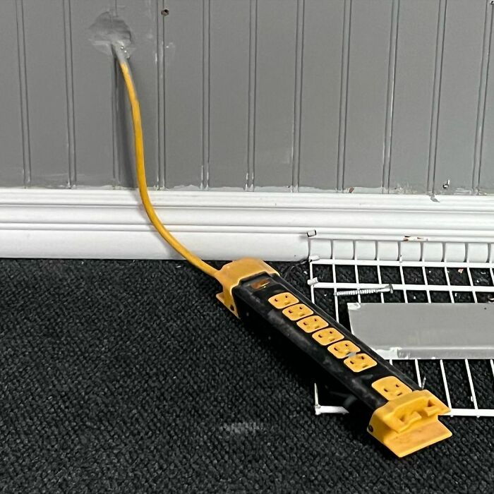 Why Hire An Electrician When You Can Just Improvise? An Extension Cord Turned Permanent Outlet! Remember Folks, Some Things Are Best Left To The Professionals