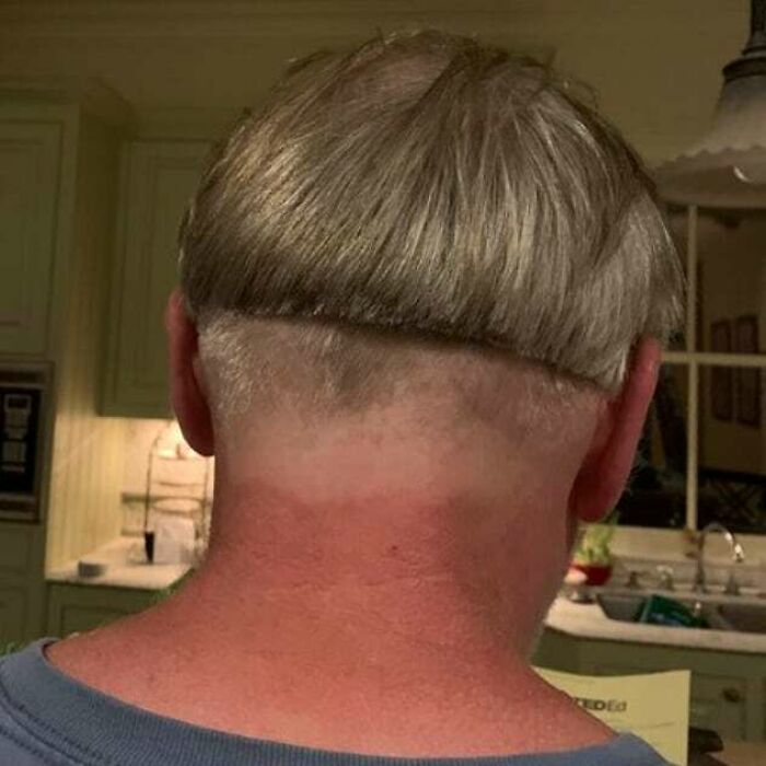 Unsuccessful haircut showcasing uneven bowl cut and shaved areas, illustrating hair-cutting-dyeing-fails in a humorous setting.