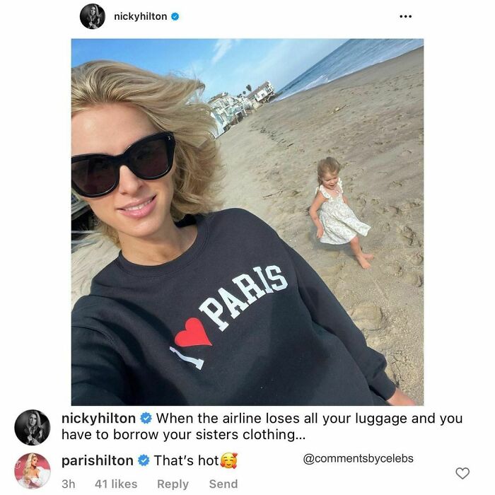Celebrity on the beach in a "I ❤️ Paris" sweater with funny comments exchange with another celeb.
