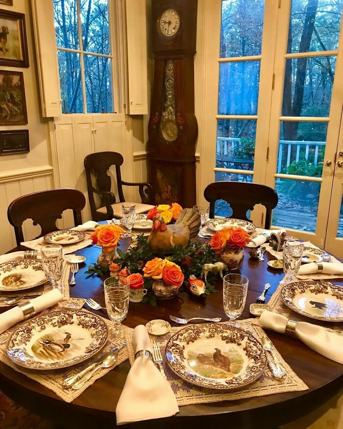Thanksgiving home decor featuring a beautifully set table with floral centerpiece and themed plates.