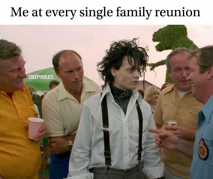 Person in gothic attire at family gathering, surrounded by men, capturing a twist of horror humor.