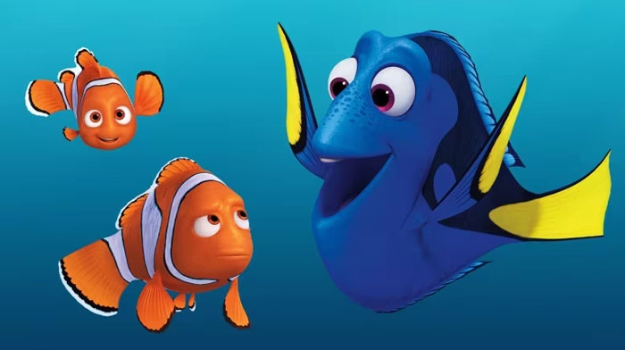 A famous trio from Finding Nemo, featuring Marlin, Nemo, and Dory in an underwater scene, with Dory smiling brightly at Marlin and Nemo.