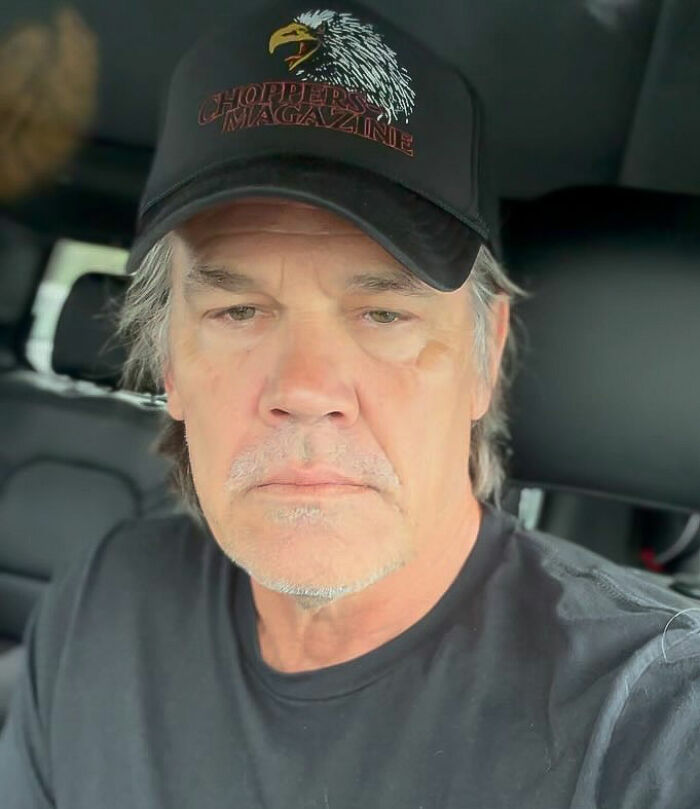 Man in a car wearing a Chopper Magazine cap, related to mountain lions and cougars story.