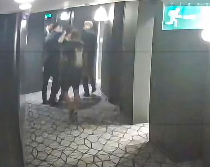 CCTV footage of a group in a corridor with dim lighting, related to Liam Payne's final moments. CCTV footage of a group in a corridor with dim lighting, related to Liam Payne's final moments.