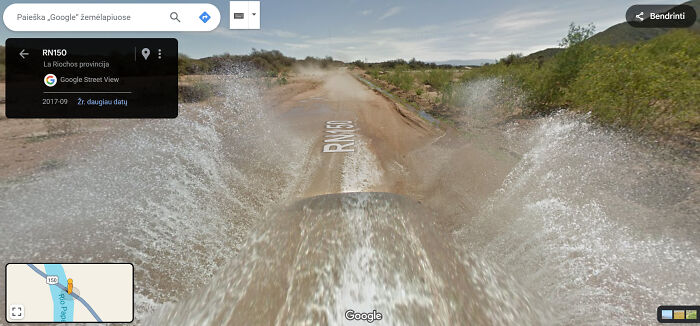 Google Street View captures water splashing on rural road RN150 in La Rioja, creating a funny and unusual scene.