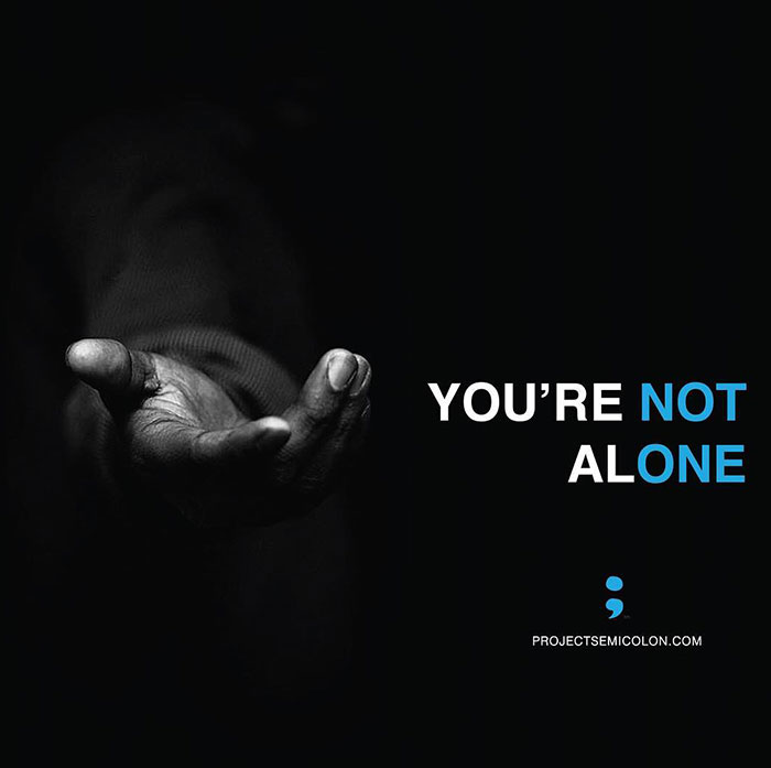 A black-and-white image with an outstretched hand and the words 