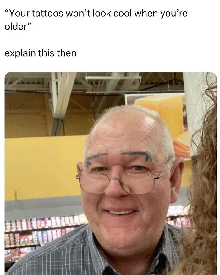 Man with glasses and tattooed eyebrows in a humorous tattoo fail moment in a store.