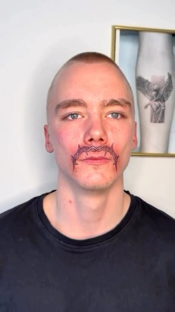 Man with a tattoo resembling a mustache, illustrating a tattoo fail.