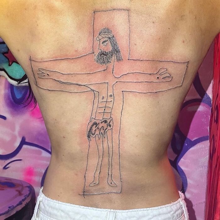 Amateur back tattoo resembling a stick figure Jesus, showcasing epic tattoo fails.