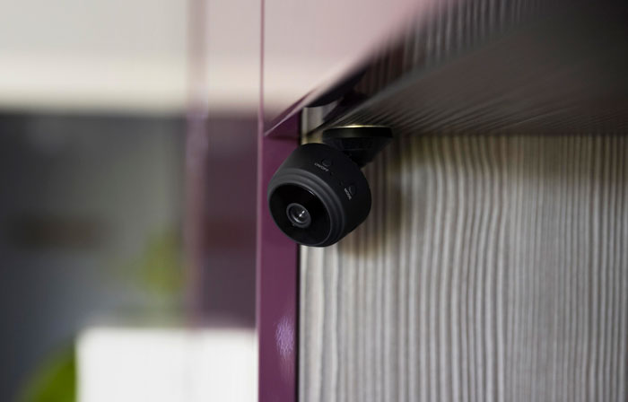 Discreet bed camera for recording mounted in a room corner. Discreet bed camera for recording mounted in a room corner.