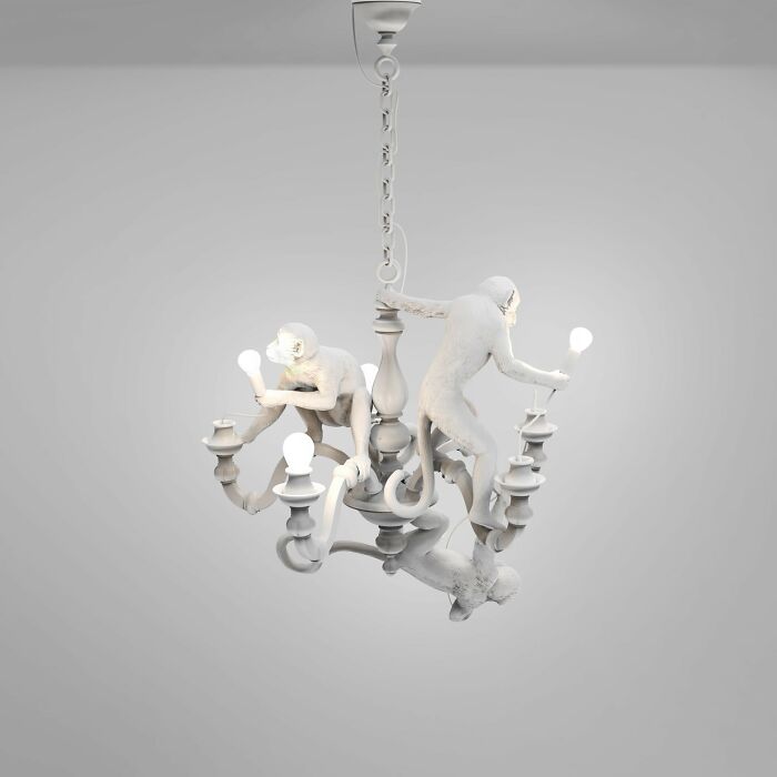 Chandelier with monkey-shaped light fixtures in white, showcasing designers creating something that will have to be cleaned.