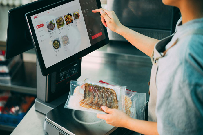 Person using a touchscreen to add extra fee to a sibling's meal bill, highlighting privileged family dynamics. Person using a touchscreen to add extra fee to a sibling's meal bill, highlighting privileged family dynamics.