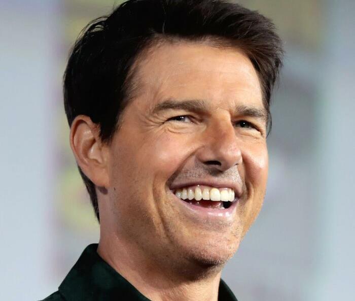 Smiling male celebrity at an event, representing celebrities people lost respect for.