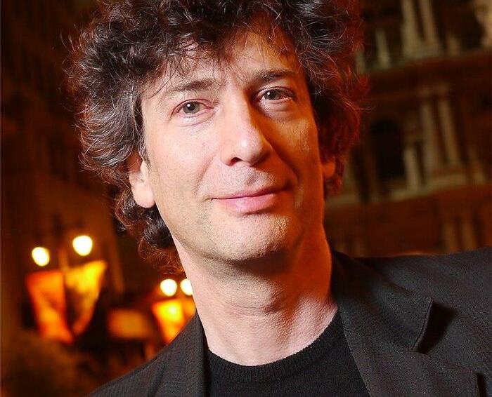 A person with curly hair at a nighttime event, representing celebrities people lost respect for.