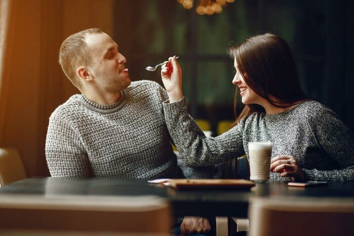 Couple enjoying a meal together, highlighting veganism and dietary choices.