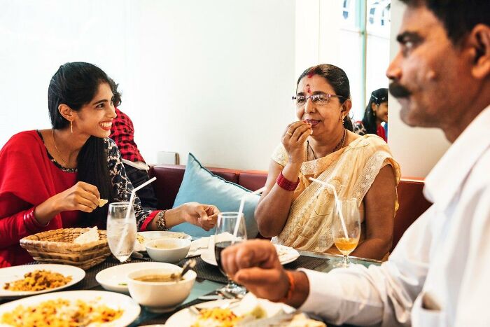 Family enjoying a meal together, featuring dishes rich in iron to support healthy blood donation.