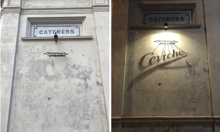 Creative design transforms plain wall into a shadow art display, showcasing the word "Ceviche" under a "Caterers" sign.