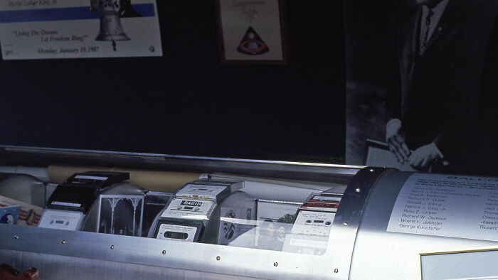 Time capsule filled with vintage electronics and documents, representing a historical snapshot.