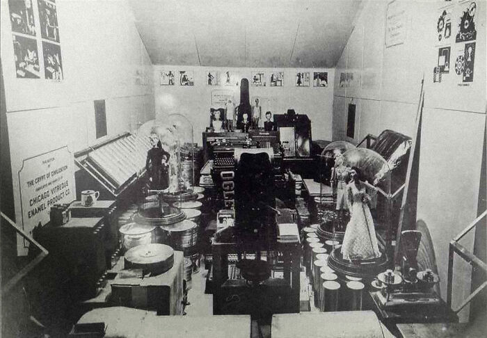 Vintage historical time capsule with various items, posters, and memorabilia displayed inside a room.