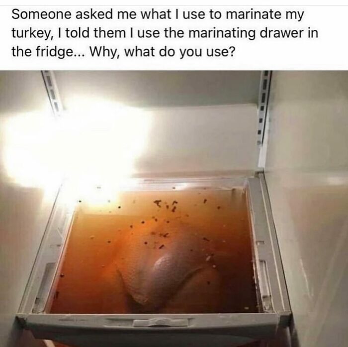 Turkey marinating in fridge drawer, covered in sauce; a humorous example from an Instagram account focused on 'dude fridges'.