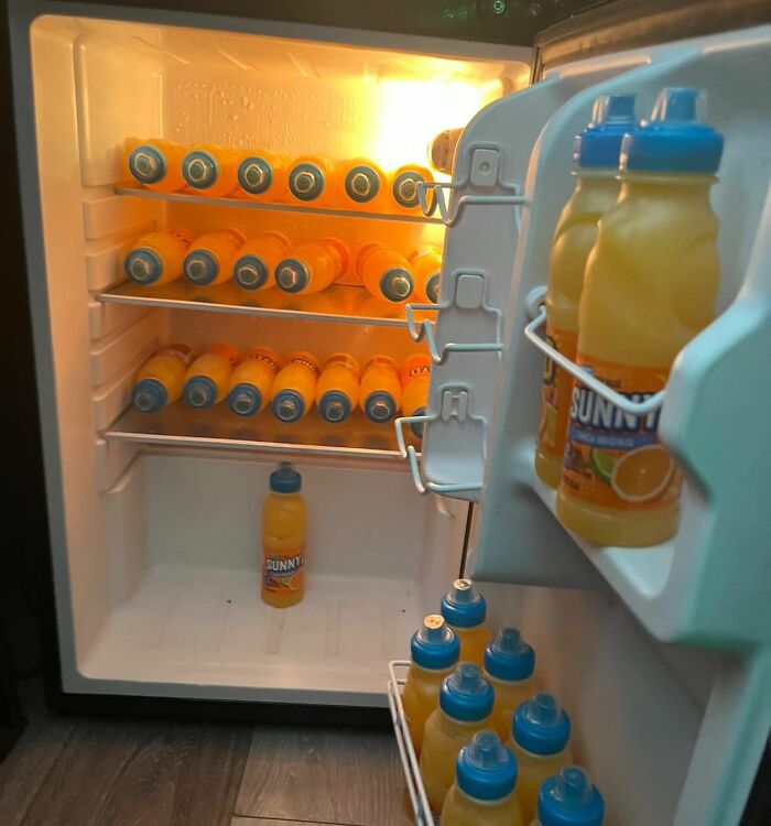 Open fridge filled with SunnyD bottles, showcasing a typical 'dude fridge' scene.