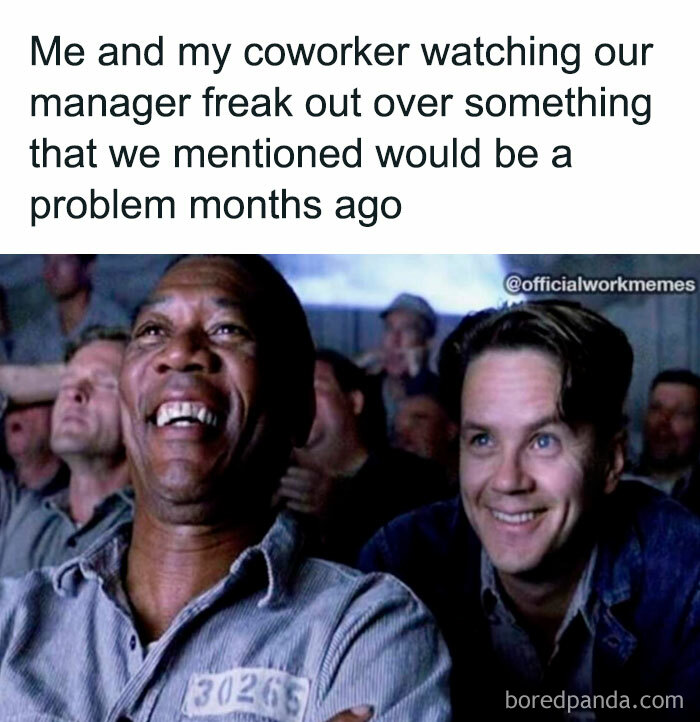 Two men laughing, enjoying a meme about work issues.