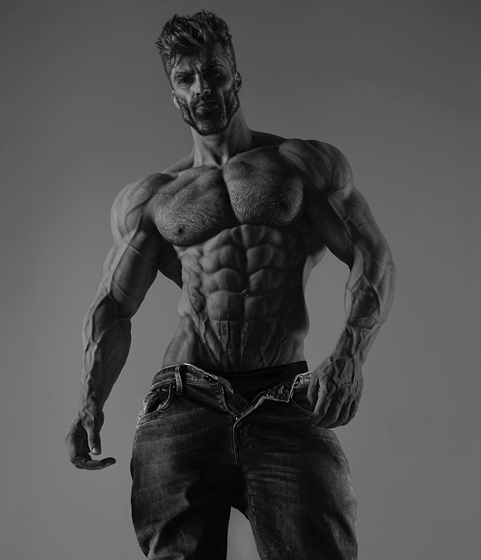 Grayscale photo of muscular man with chiseled abs, embodying the Giga Chad meme's aesthetic of extreme masculinity.