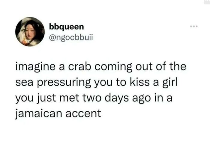 Humorous tweet imagining a crab pressuring you to kiss with a Jamaican accent.
