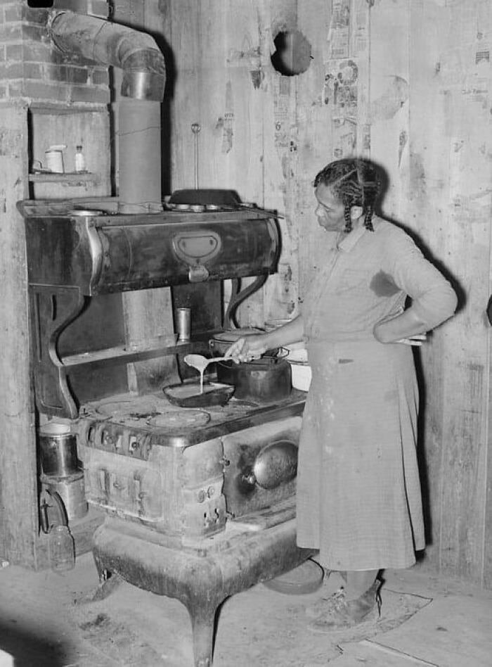 Woman Preparing Gravy In The Kitchen, Missouri, 1938
