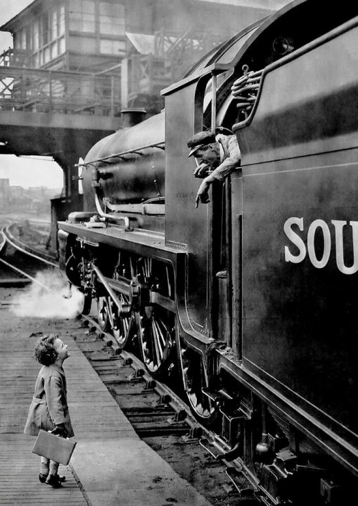 Little Girl Talking With Her Father, A Train Driver For Southern Railway's Southern Belle Steam Train, Before He Leaves On A Trip To Brighton - London, 1931